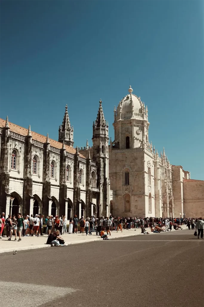 Explore the stunning Gothic architecture of Jerónimos Monastery in Lisbon, Portugal.