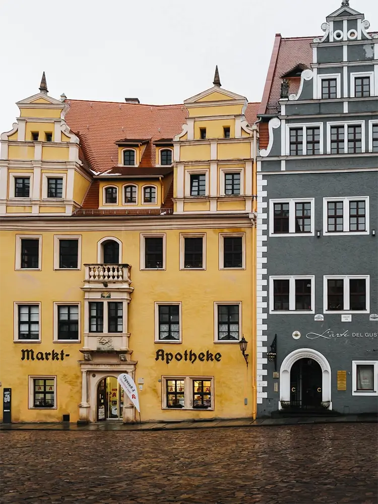 Charming cobblestone street lined with colorful historic houses in Meißen