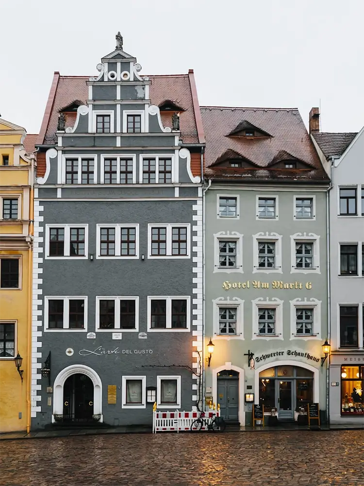 Charming cobblestone street lined with colorful historic houses in Meißen