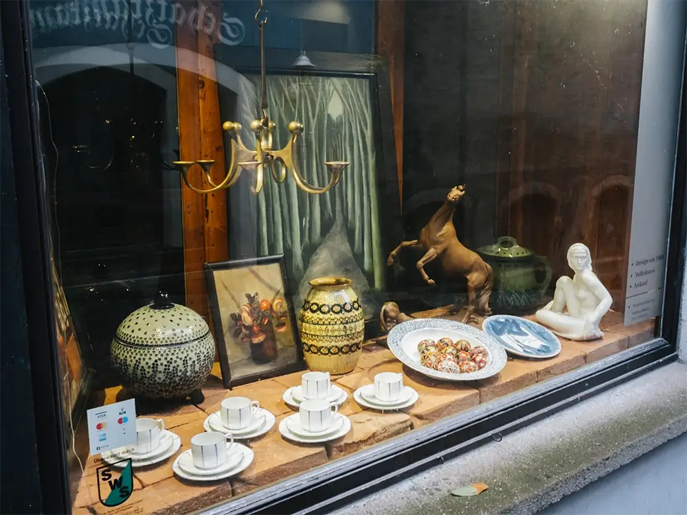 Artisan hand-painting intricate designs on Meissen porcelain