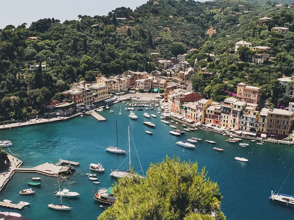 Why Should You Visit Portofino on the Italian Riviera? 2 Panoramic view of Portofino's harbor and colorful buildings from Castello Brown