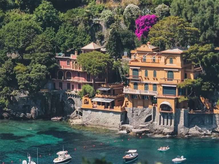 Why Should You Visit Portofino on the Italian Riviera? 7 Panoramic view of Portofino's harbor and colorful buildings from Castello Brown